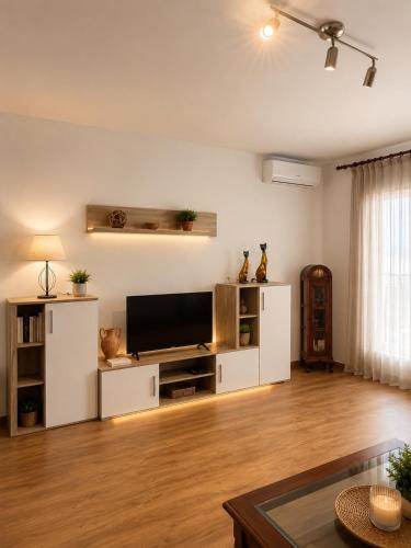 a large living room with a flat screen tv at Amazing view bungalow MA2 in Torrevieja