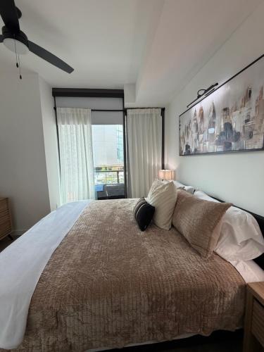 a bedroom with a large bed and a window at Atl oasis in Atlanta