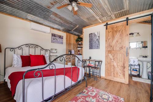 a bedroom with a bed and a wooden ceiling at Hill Country Cabin 4 in Canyon Lake