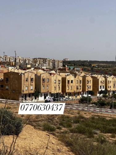 a view of a city with buildings in the background at مستغانم حي السلام المجدوب in Sidi Mohammed Medjoub