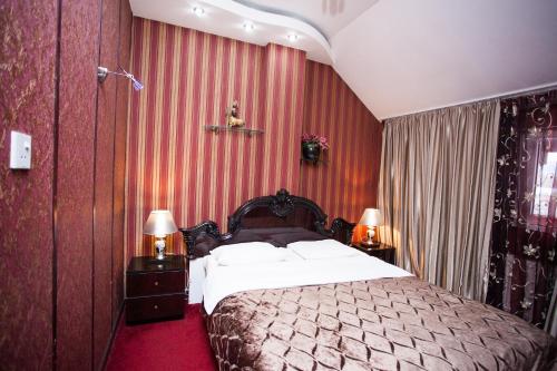 Postel nebo postele na pokoji v ubytování Bella Donna Hotel