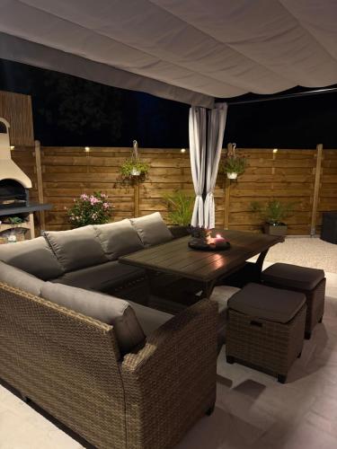 a living room with a couch and a table at Dalmatian Stone House Angela in Drniš