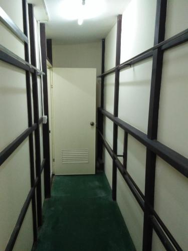 an empty room with a door and a hallway at Northern Breeze Hotel in Bagan
