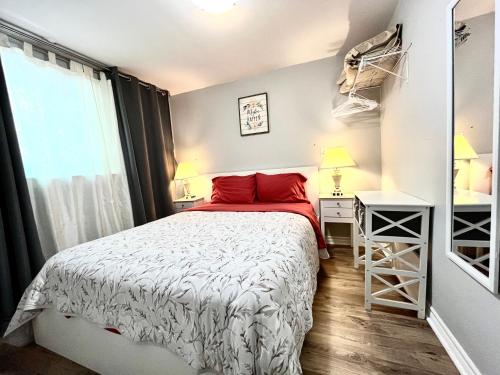 a small bedroom with a bed and a window at Barker house-Sweet home in Niagara-on-the-Lake