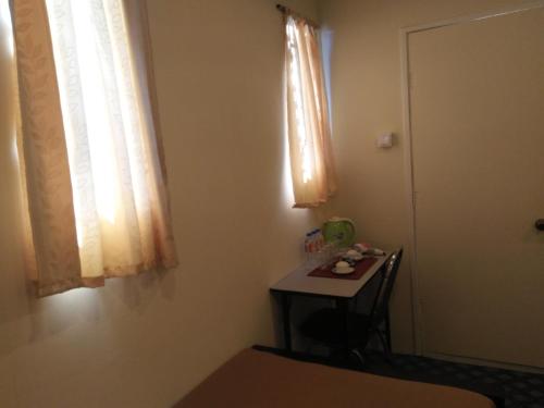 a room with a small table and a window at Northern Breeze Hotel in Bagan