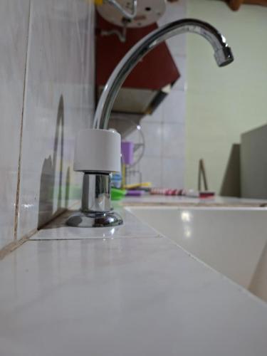 a kitchen sink with a faucet and a sink at Cabañas Nono Mario in San Rafael