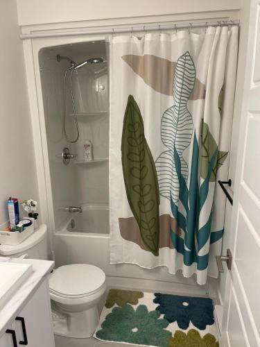 a bathroom with a shower curtain with a mermaid on it at Orgive Suite - Private 1 Bedroom Apartment in Riverview
