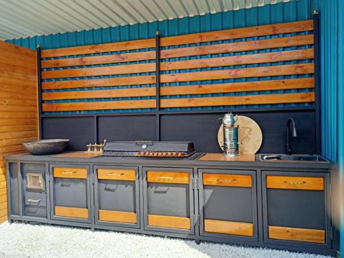 a kitchen with a stove and a counter top at Laguna Relax in Balqash