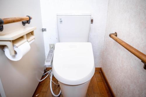 a bathroom with a white toilet in a room at 白灯-Hakuto- Muikamachi in Minami Uonuma