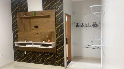 a bathroom with a sink and a shower at Lar com piscina in Primavera do Leste