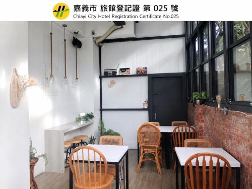 a restaurant with tables and chairs in a room at Prince Hotel in Chiayi City