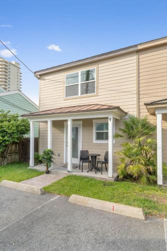 a house with a table and chairs in front of it at Helena's Place, Exclusive End Unit Townhouse in Destin