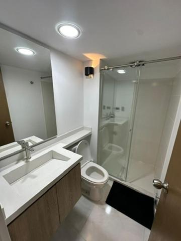 a bathroom with a shower and a toilet and a sink at Moderno loft en el oeste in Cali