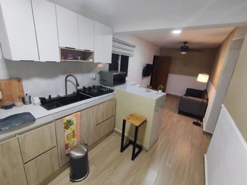 a kitchen with a sink and a counter top at Lugar tranquilo in Santo Domingo