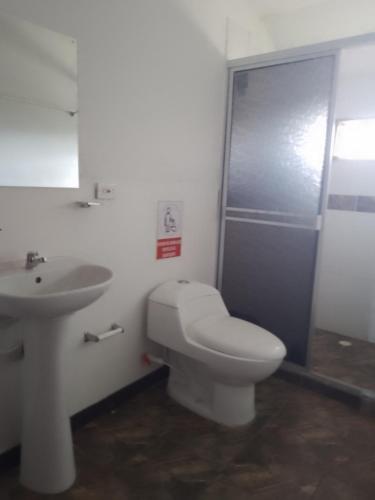a bathroom with a toilet and a sink at Villa Isabel in La Tebaida
