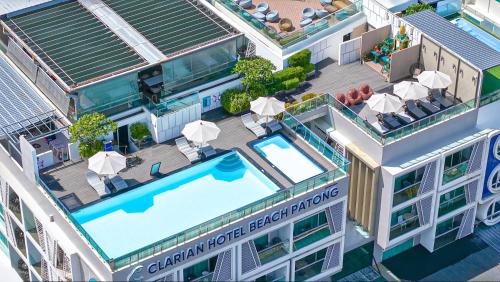 an overhead view of a building with a swimming pool at Clarian Hotel Beach Patong in Patong Beach