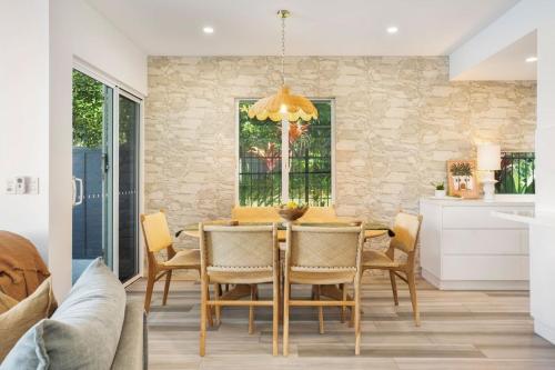 a dining room with a table and chairs at Townhouse 6 Sunseeker Close 26 in Noosaville