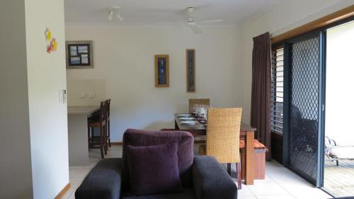 a living room with a couch and a table and chairs at Sol Y Olas Sun and Waves in Arcadia