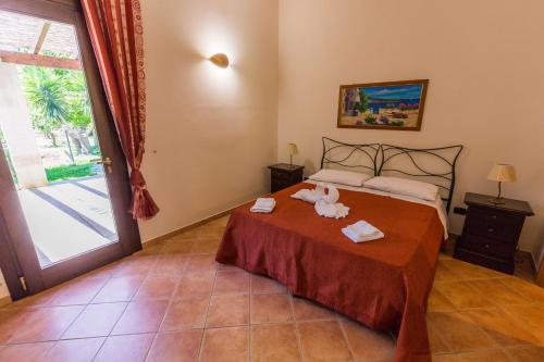 A bed or beds in a room at Agriturismo Monte degli Angeli