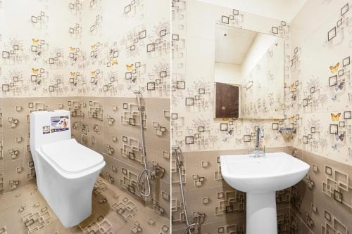 a bathroom with a toilet and a sink at Super Collection O Friends Colony Lucknow Formerly The Suite in Lucknow