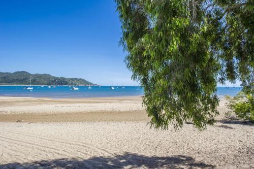 a view of a beach with boats in the water at On the Beach in Horseshoe Bay