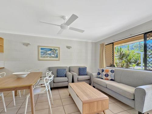 a living room with a couch and a table at Arcadia Palms 2 in Arcadia