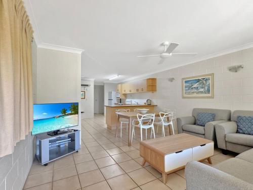 a living room with a couch and a table at Arcadia Palms 2 in Arcadia