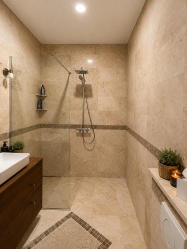 a bathroom with a glass shower and a sink at Sunset Vista Sonnenuntergang mit Jacuzzi und Sauna in Katun