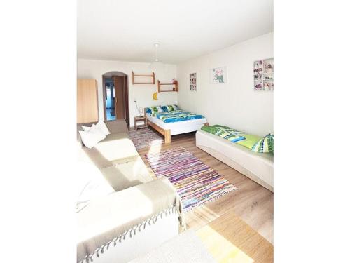 a living room with two beds and a couch at Dürnberger in St Martin in Scheffsnoth
