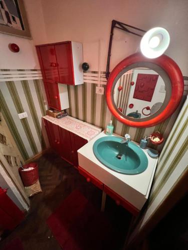 a bathroom with a sink and a mirror at The Shepherd tent on Acquaviva Bay in Marittima
