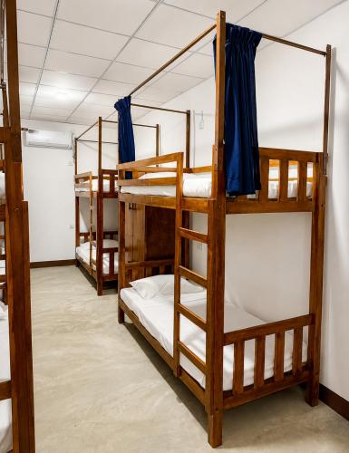 a group of bunk beds in a room at Wave Hostels Arugam Bay - With Swimming Pool in Arugam Bay