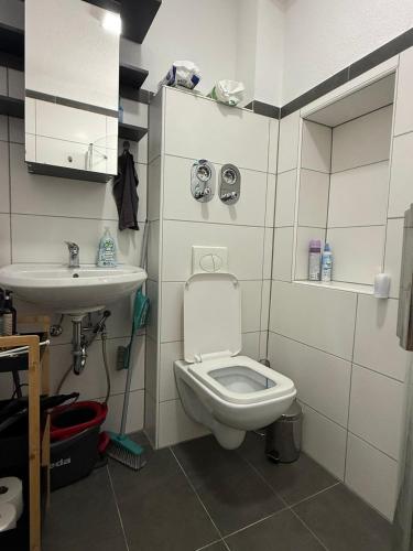 a small bathroom with a toilet and a sink at Team at Home Senden W2 in Senden
