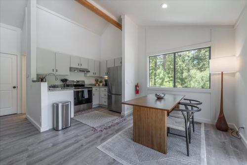 a kitchen with a wooden table in a room at Alpenglow Loft condo in Olympic Valley