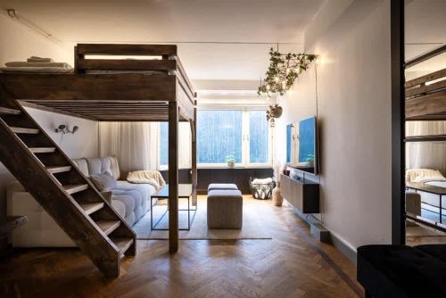 a bedroom with a bunk bed and a living room at Tott vacation homes in Åre