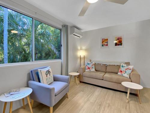 a living room with a couch and a chair at Magnetic Haven Unit 5 in Arcadia