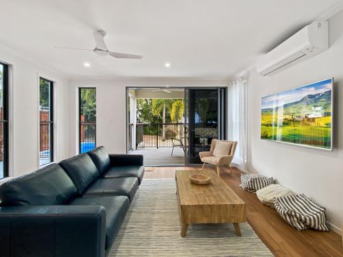 a living room with a couch and a coffee table at Picnic Point in Picnic Bay
