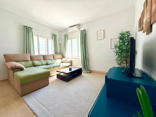 a living room with a couch and a tv at Moon Stylish -FREE parking -Romantic City Stay in Timişoara