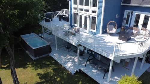 an overhead view of a deck on a house at Luxurious Lakeside Chalet with Swim Spa in South Brook