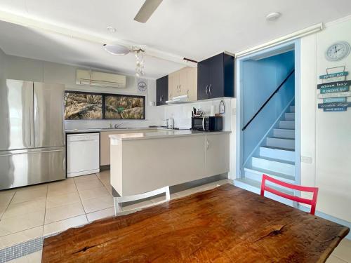 a kitchen with a sink and a counter top at Blue on Cockle in Picnic Bay