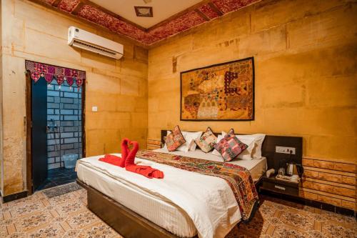 a bedroom with two beds and a window at Guesthouse Tofu- Fort View in Jaisalmer