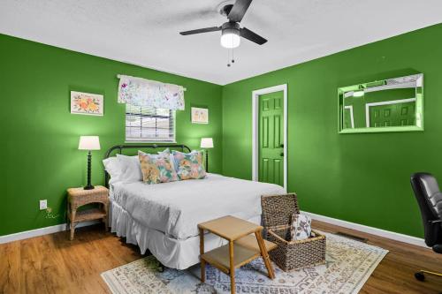 a green bedroom with a bed and a ceiling fan at 2 Bed 1 Bath Private Suite Funky Bunch TYSUT in Louisville