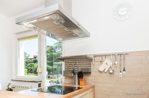 a kitchen with a sink and a stove top oven at Residence Almarea by Locap Group in Izola