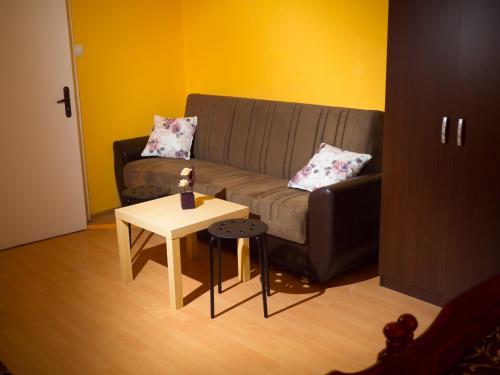 a living room with a couch and a table at Serdika Rooms in Sofia
