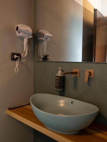 a bathroom with a white sink and a mirror at Antico Monastero del Lavello in Calolziocorte
