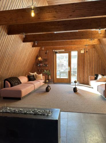 a living room with a couch and a table at Twintip Apartments in Åre
