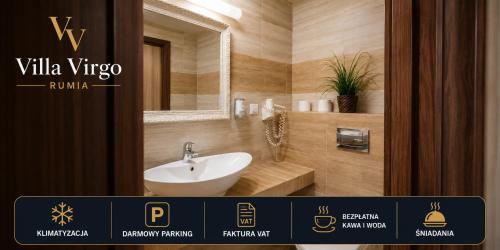 a bathroom with a white sink and a mirror at Virgo Business & Breakfast Rumia in Rumia