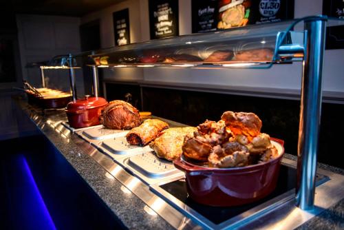 a counter with some food in an oven at The Mayfield Seamer in Scarborough