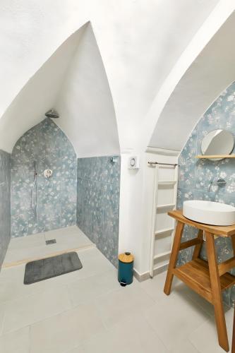 a bathroom with a sink and a shower at Dimore di Matilde - Romantic Suite in Gallipoli