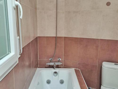 a bathroom with a sink and a toilet at Villa Eucaliptus Lloret de Mar in Vidreres