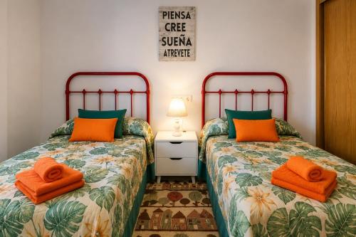 two beds sitting next to each other in a bedroom at Velez Nazari Cambriles in Lújar